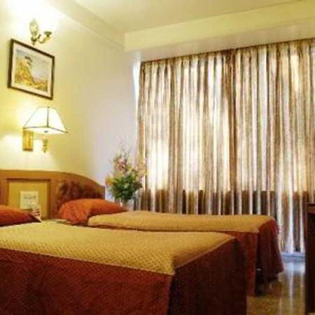 Hotel Mandakini Ambience Púna Pokoj fotografie