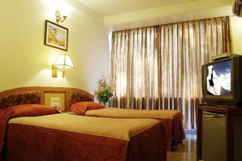 Hotel Mandakini Ambience Púna Pokoj fotografie